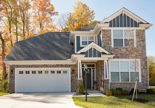 Beautiful-Luxury-Gray-Flagstone-Home-with-Garage-in-Fall